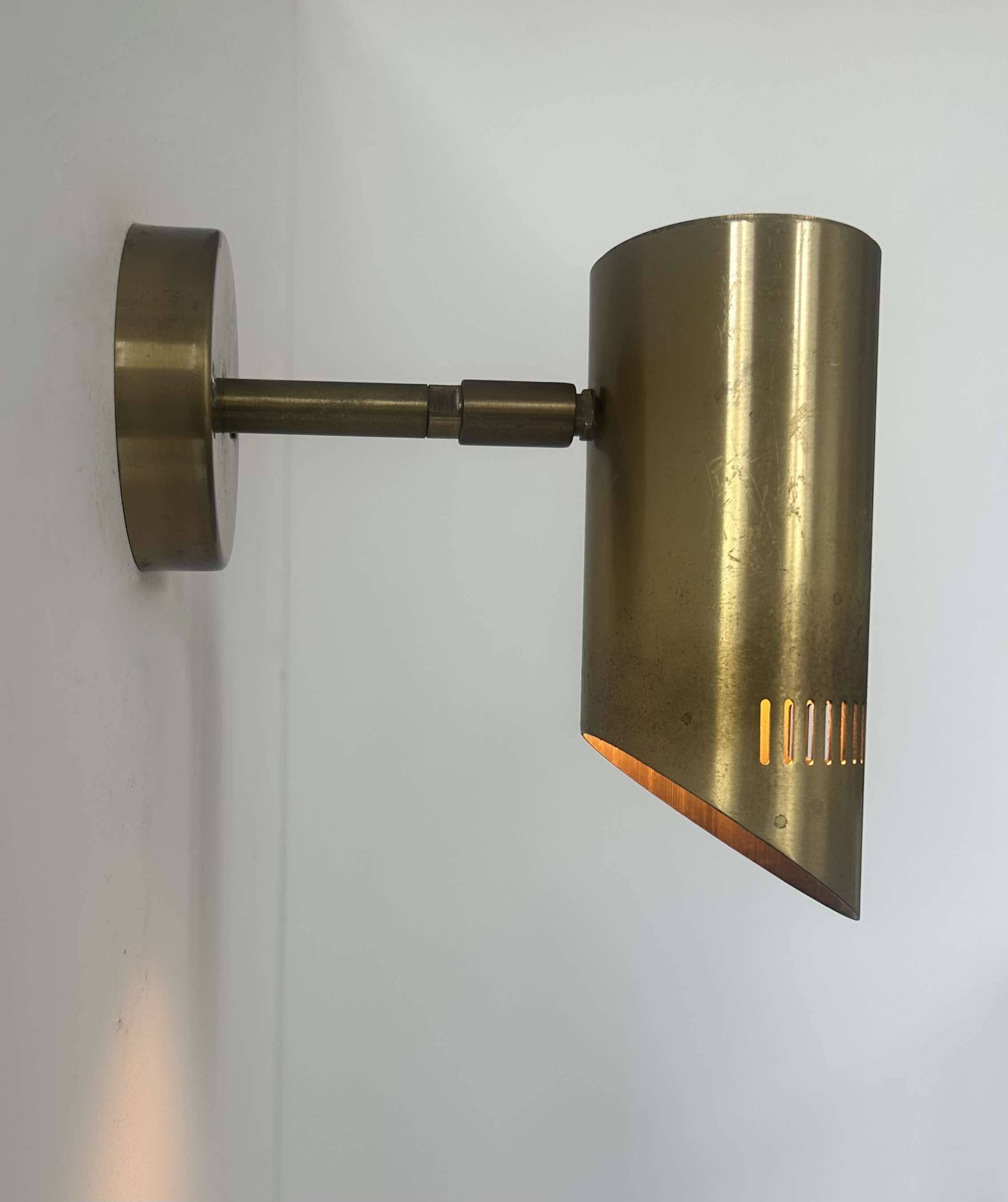 Vintage adjustable wall light, solid perforated brass, France 1960