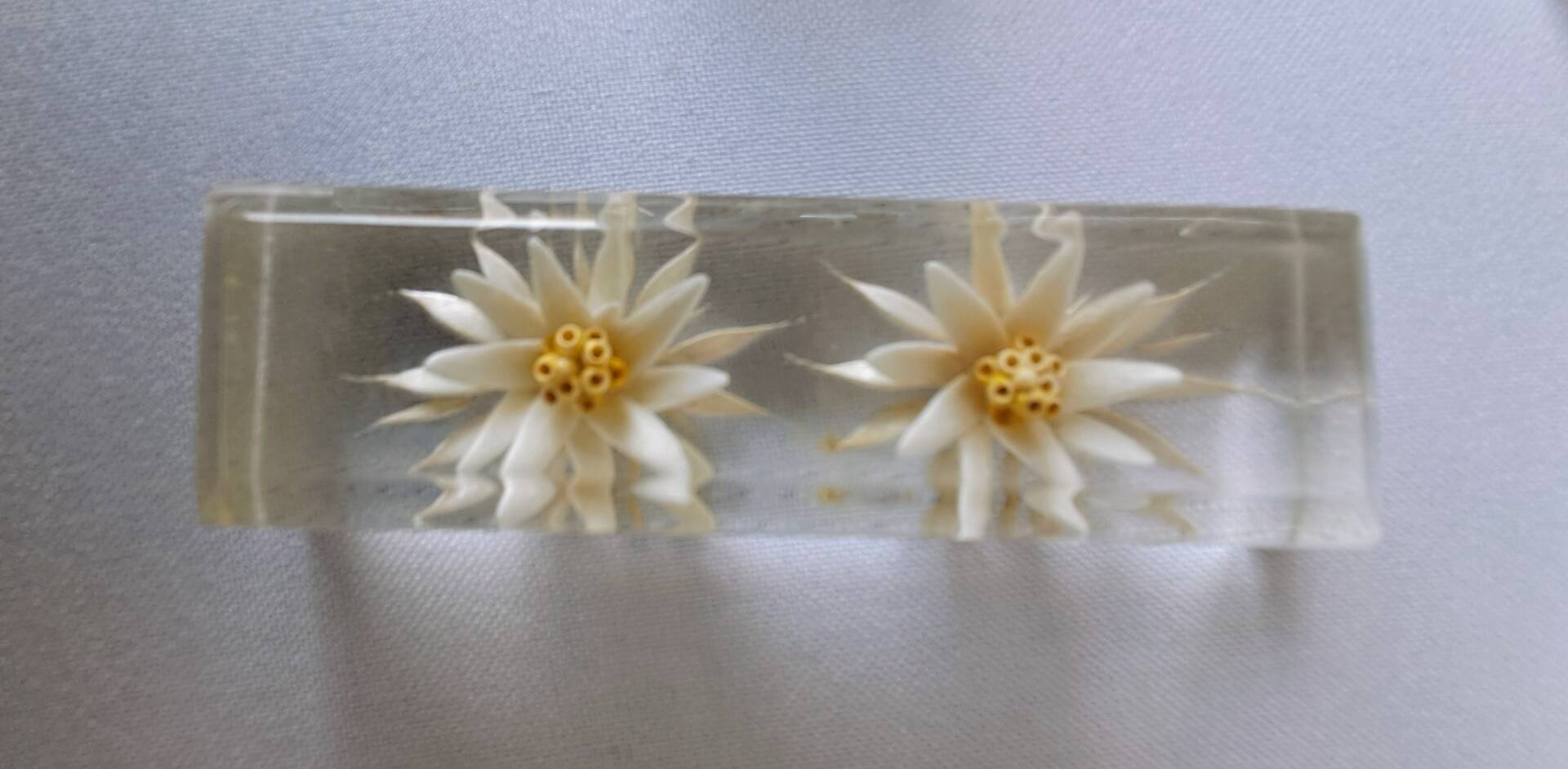 12 knife rests with resin inclusion. 1970s.