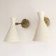 Pair of Italian wall sconces in brass and lacquered iron, 1950s design.