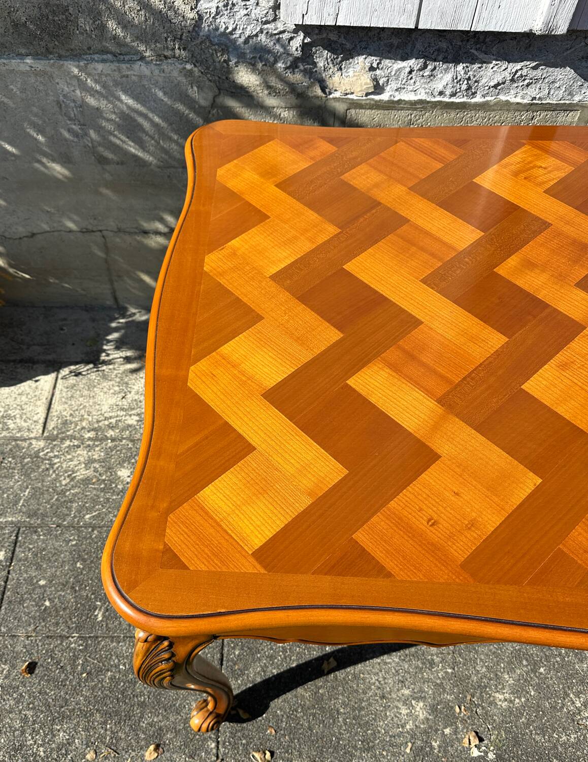 Antique extendable table in cherry wood and marquetry in the Louis XV style.