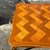 Antique extendable table in cherry wood and marquetry in the Louis XV style.