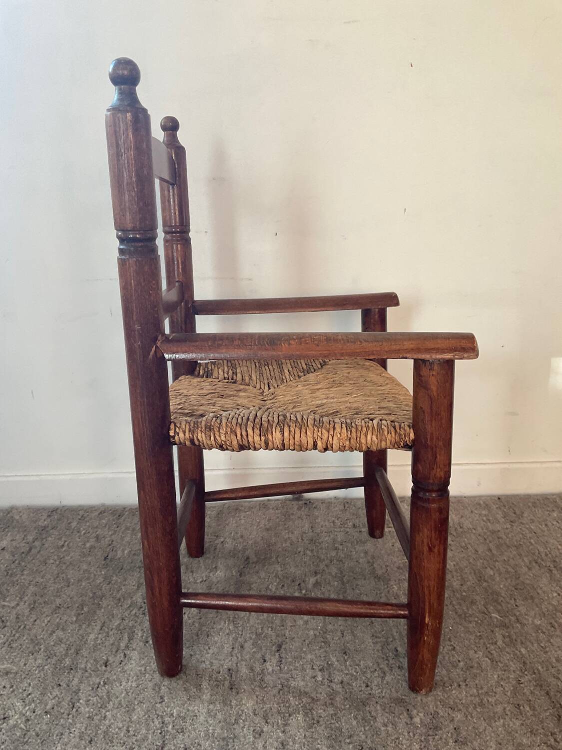 Vintage wooden armchair and straw seat for children