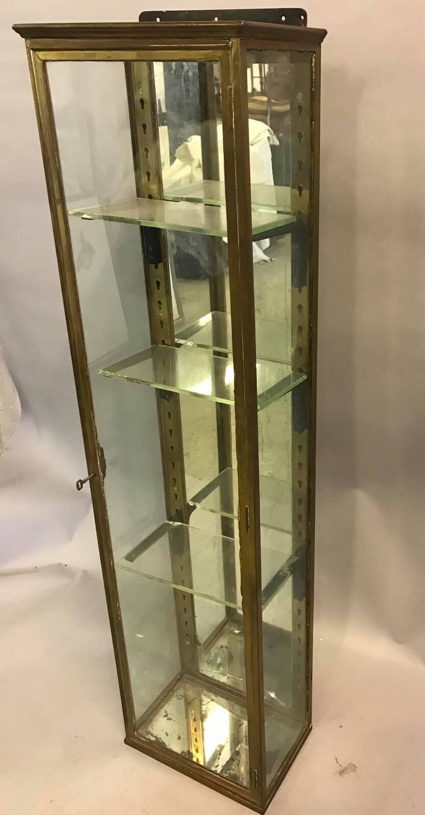 Old brass and mirror showcase