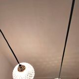 Two-light pendant in a cascade of cut crystal globe