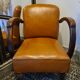 Paire de fauteuils studio simili cuir marron années 30