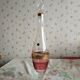 Liqueur set, colored and golden glasses and carafe