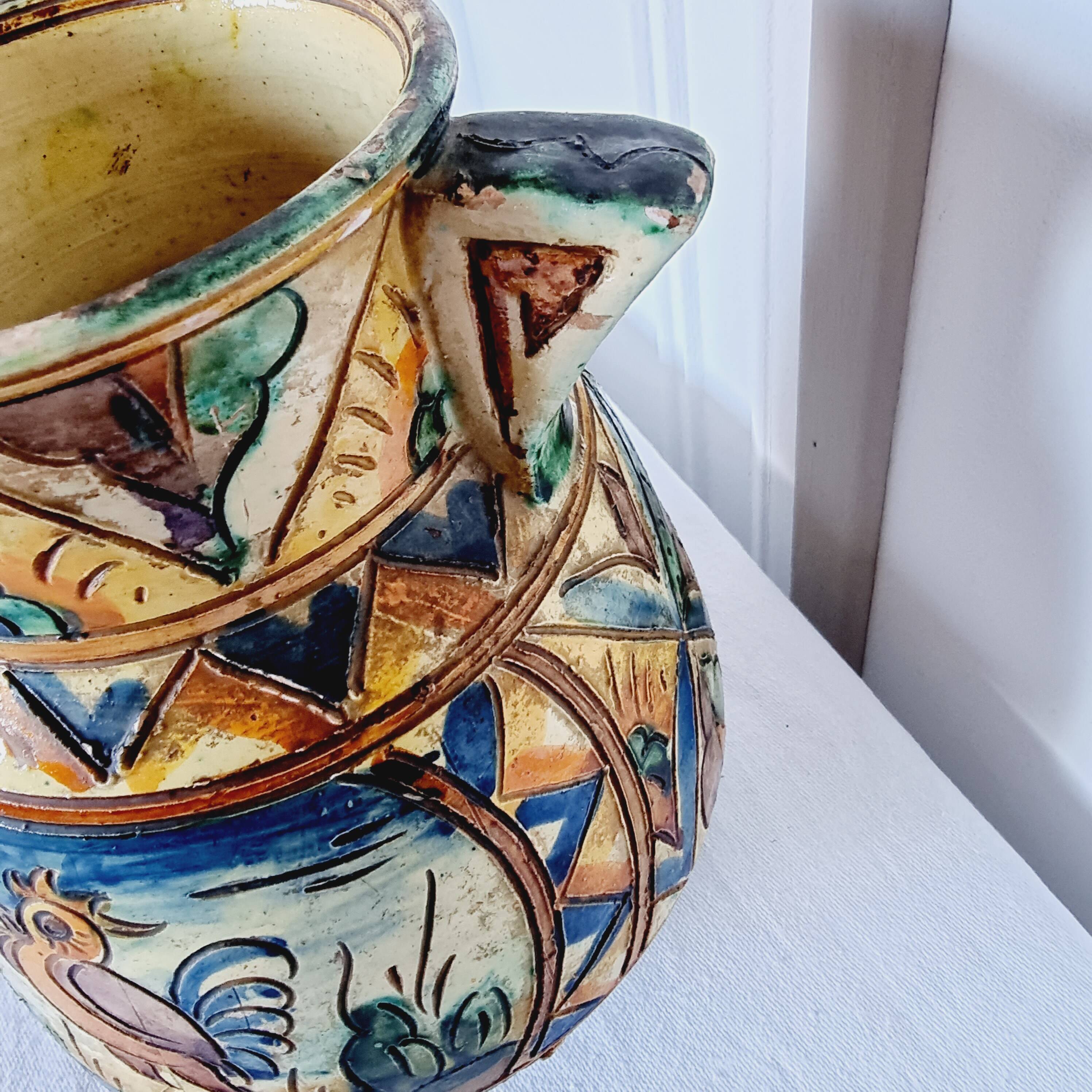 Antique majolica water pitcher made in Italy and hand painted.