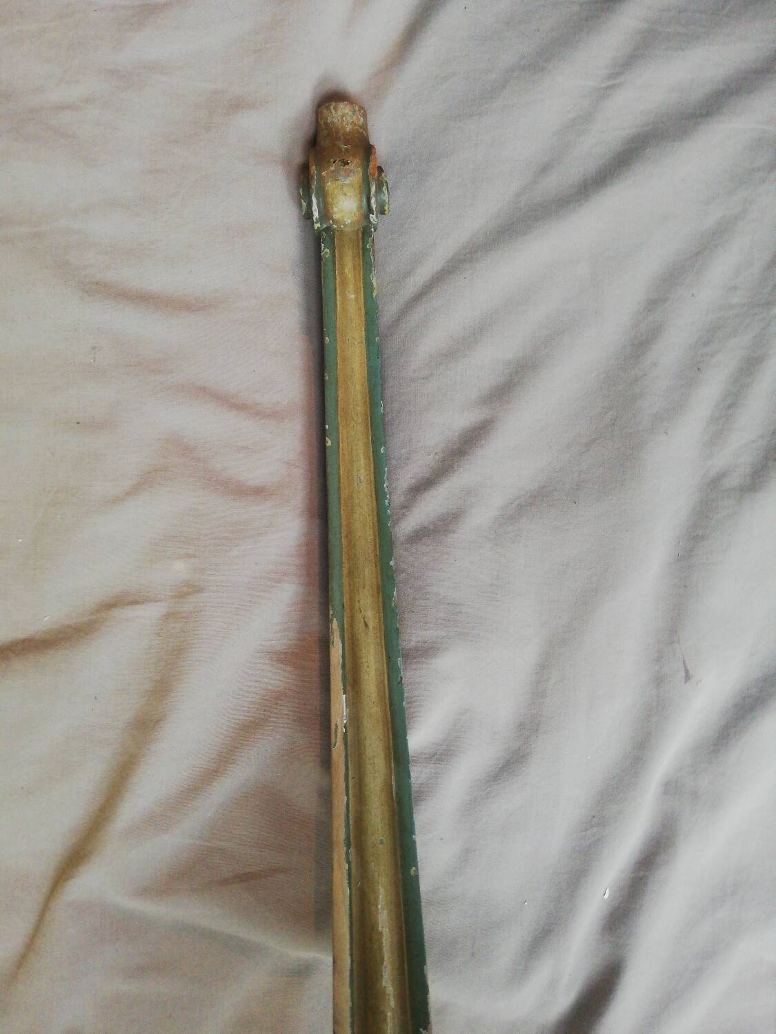 Golden wooden corner column and marble