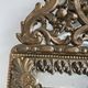 Small mirror with brass parcloses in repoussé style Louis XIV, late 19th century.