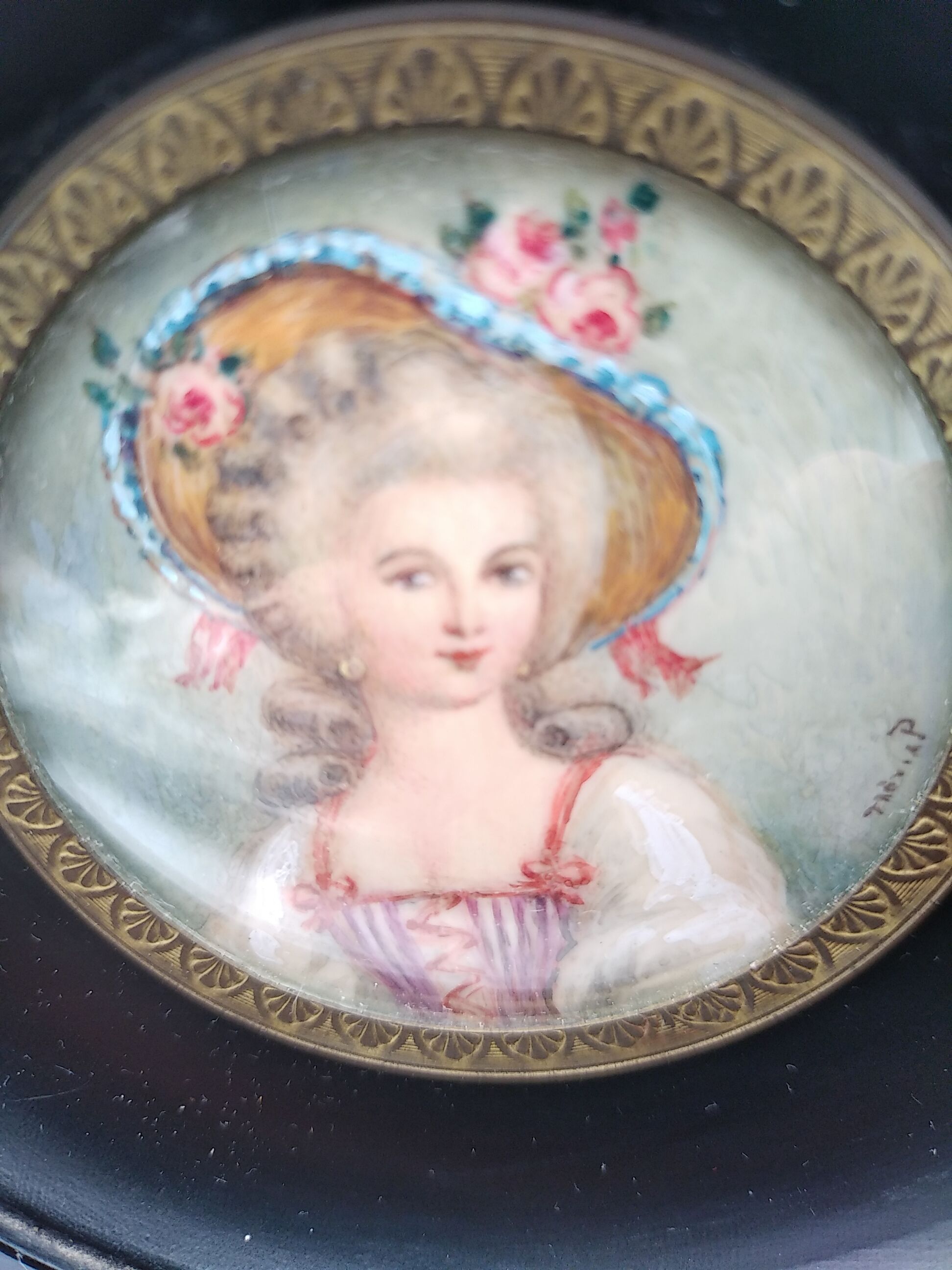 Miniature on ivory. Young woman with a flowery hat
