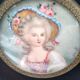 Miniature on ivory. Young woman with a flowery hat