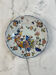 Flat plate in earthenware with polychrome decoration in Rouen style