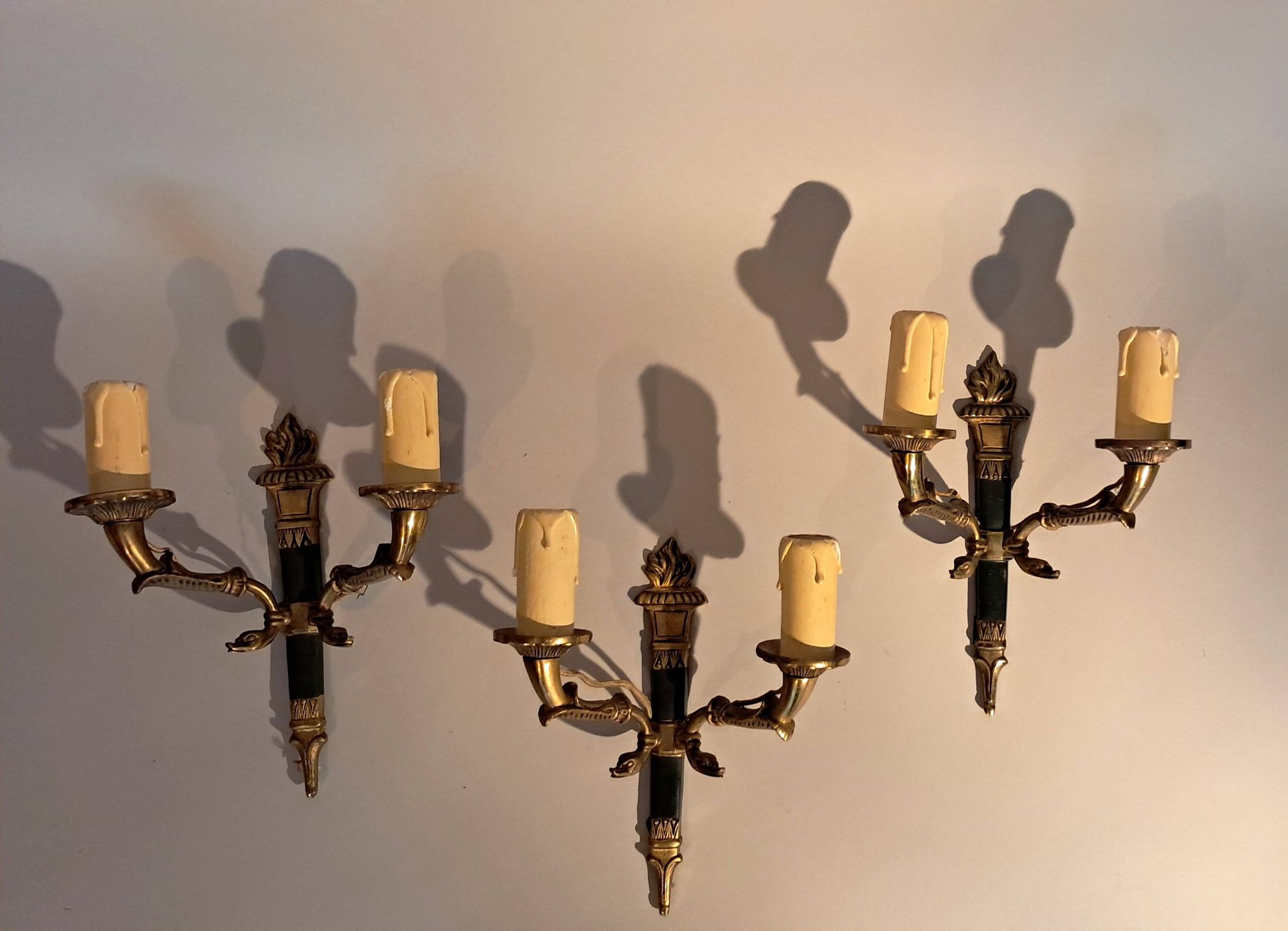 Set of 3 Empire style wall lights in bronze and gilded and green lacquered brass, Circa 1950.