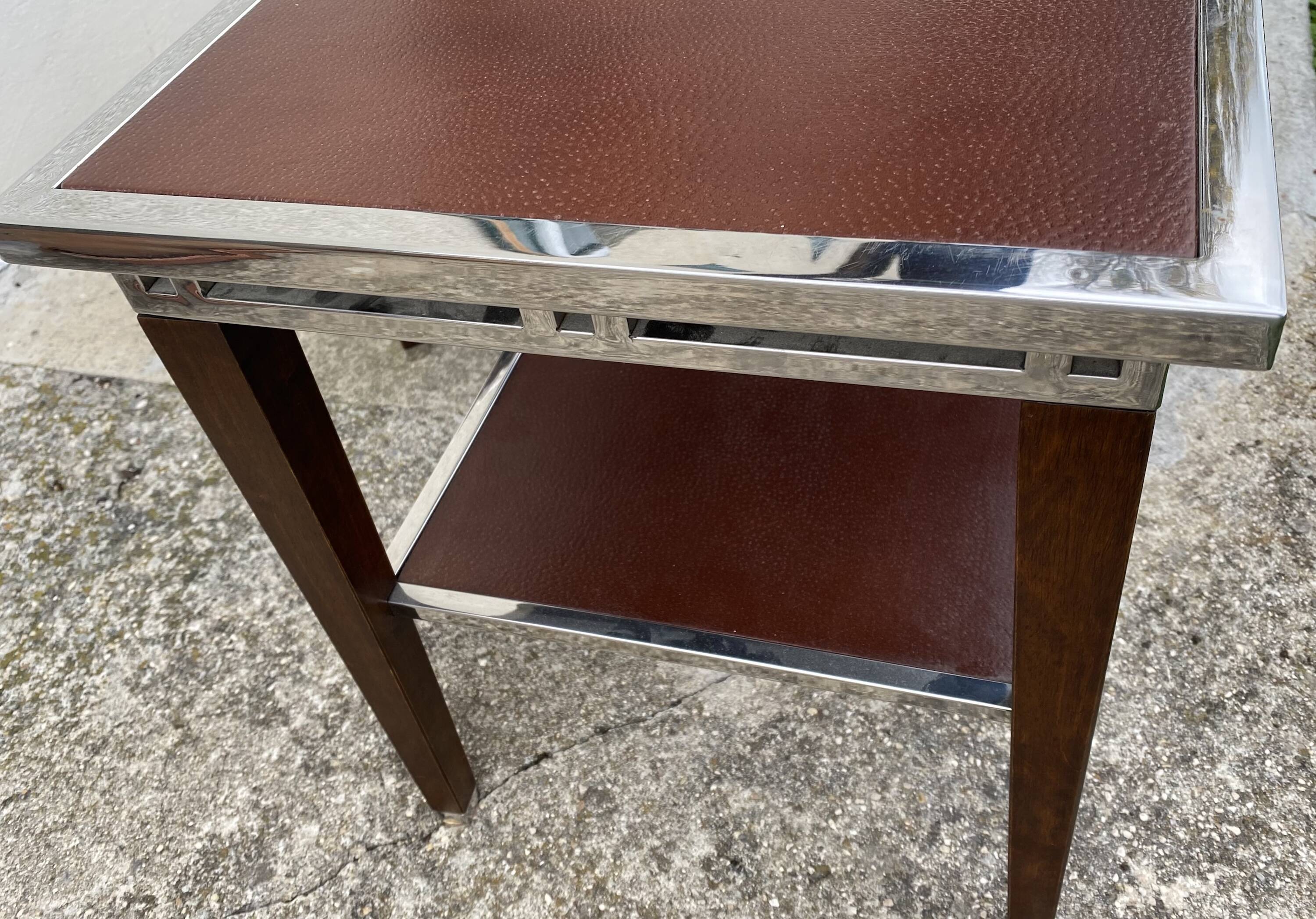 Pair of modernist chrome, leather and wood side tables