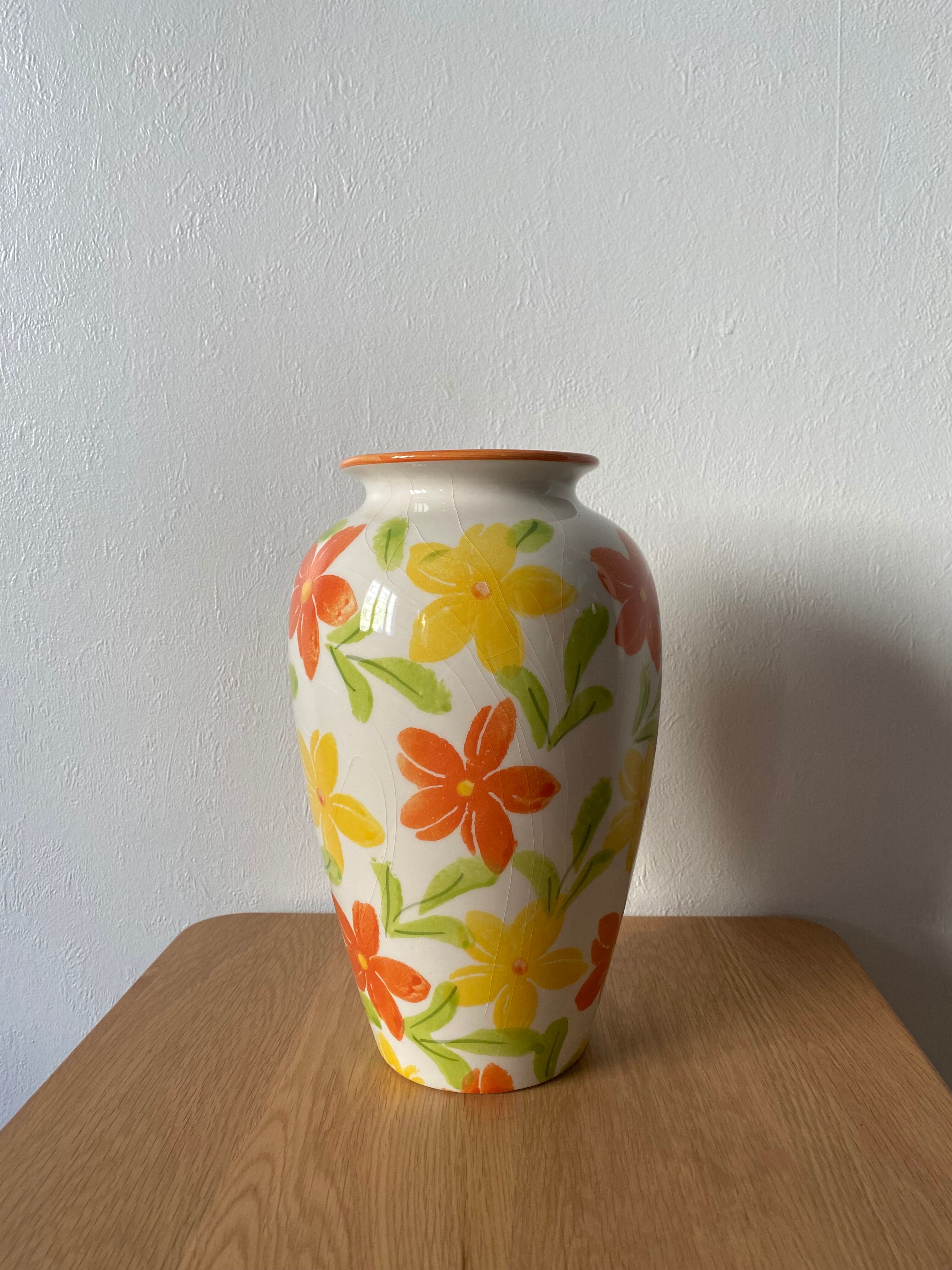 White vase with flowers