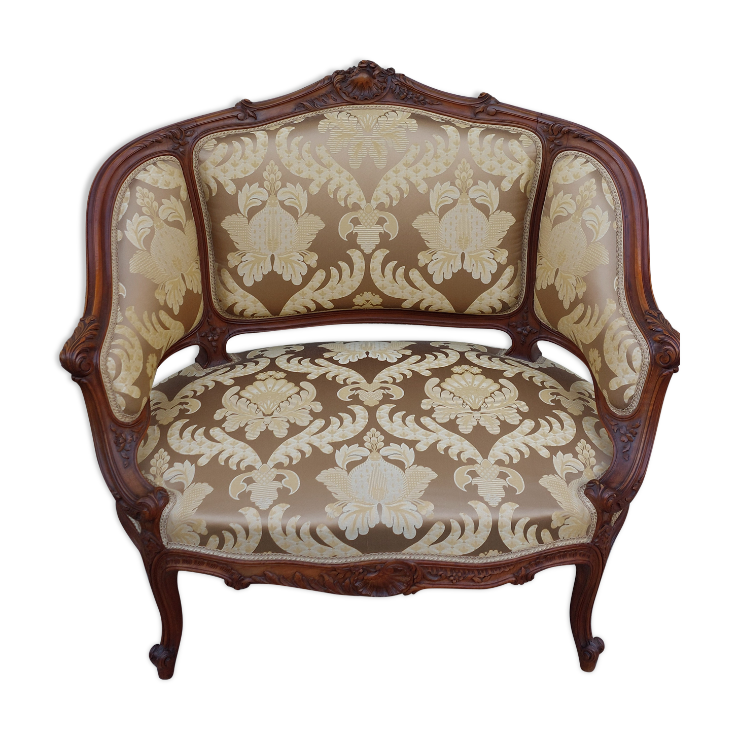 Fauteuil bergère louis XV en Noyer sculpté