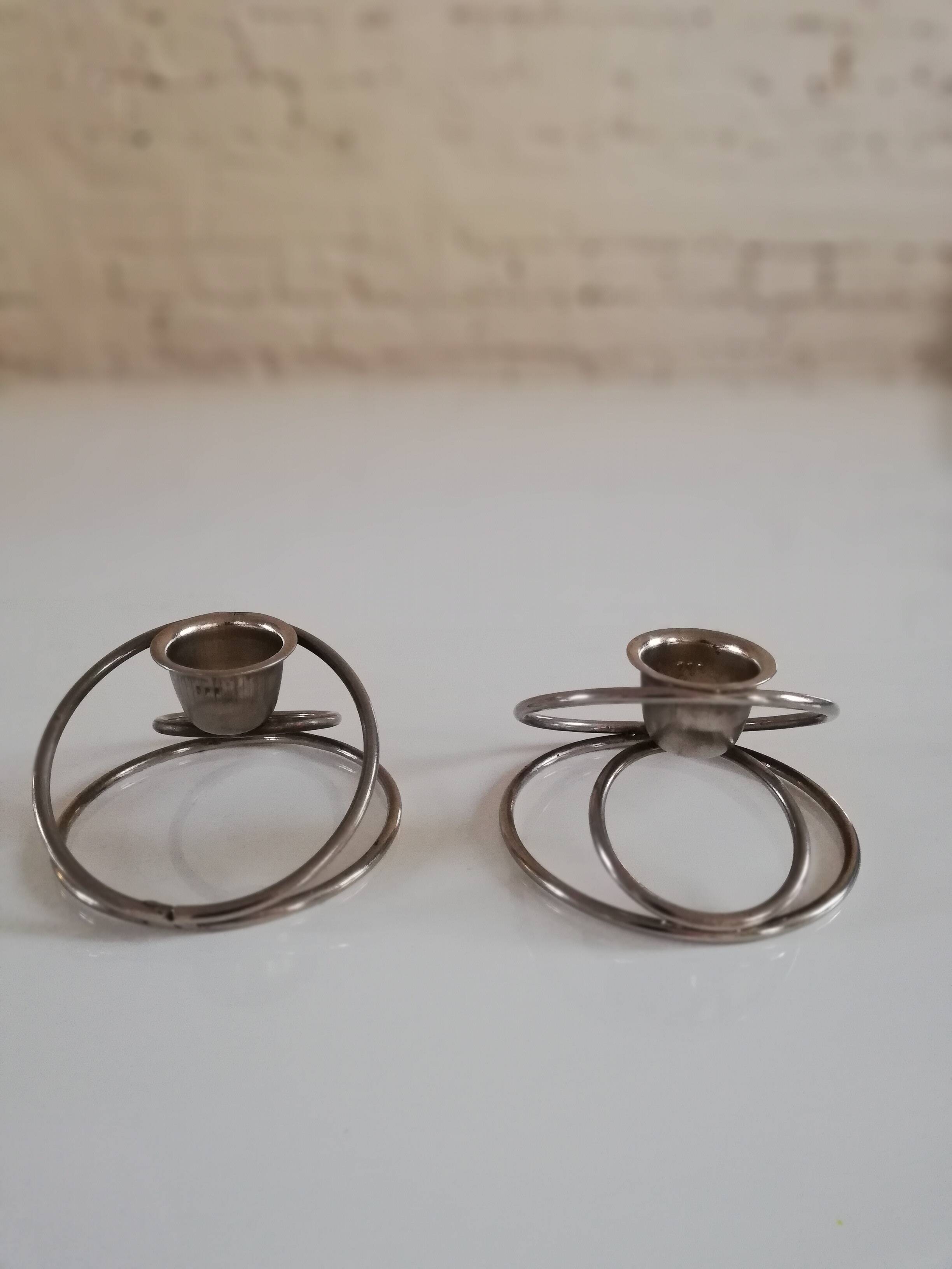 Pair of white metal candle holders