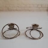 Pair of white metal candle holders