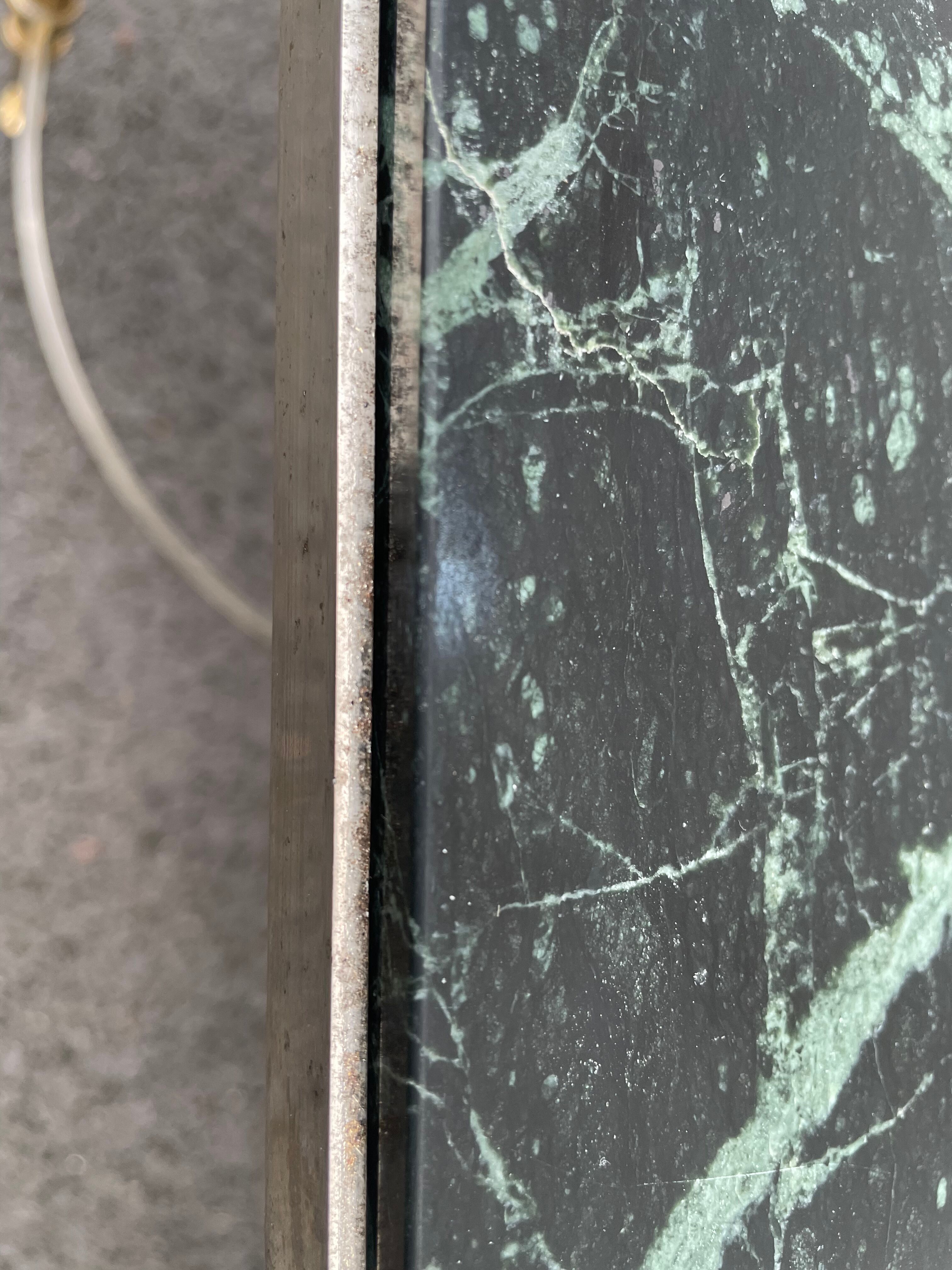Coffee table in gilded brass and veined green marble