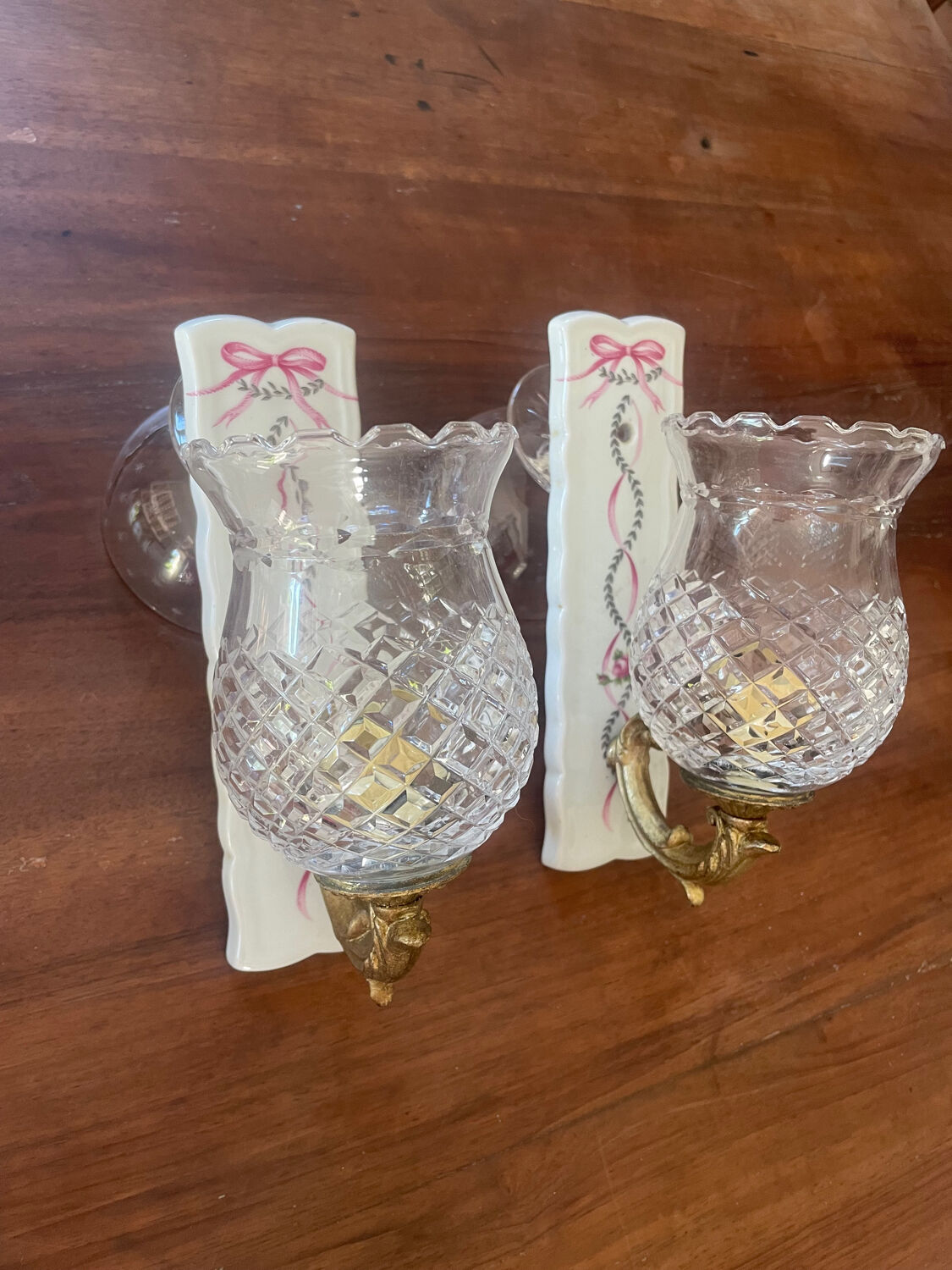 Pair of cut glass and Limoges porcelain wall sconces