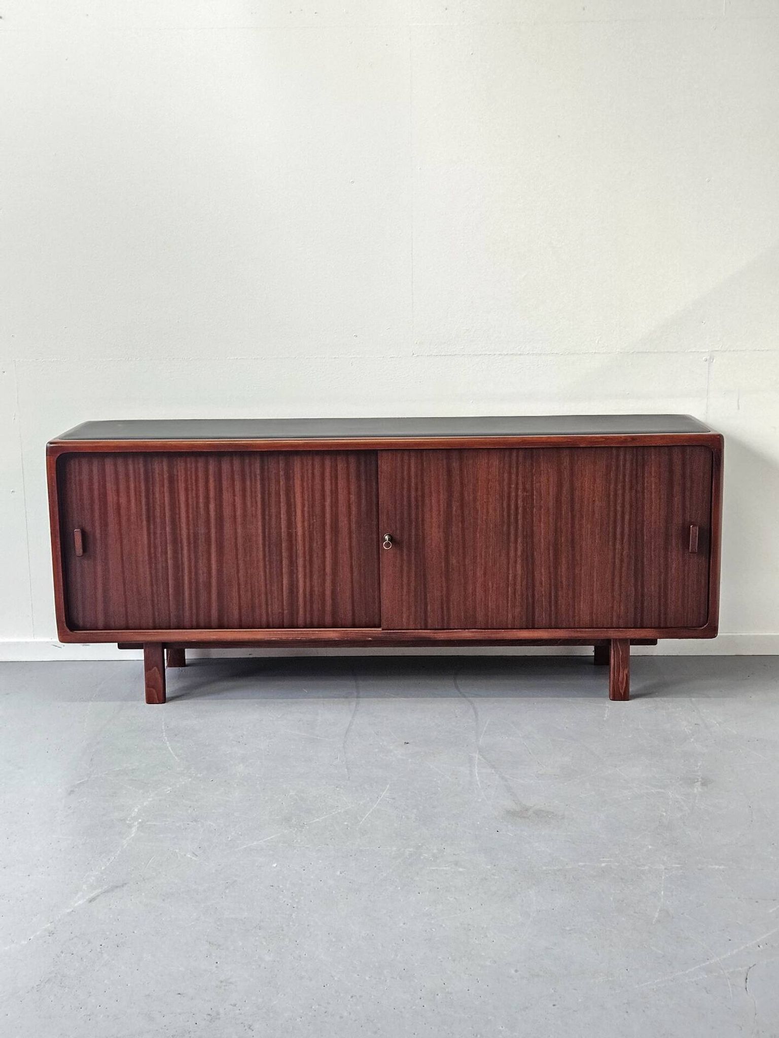 Vintage enfilade in teak and leather, 1970s.