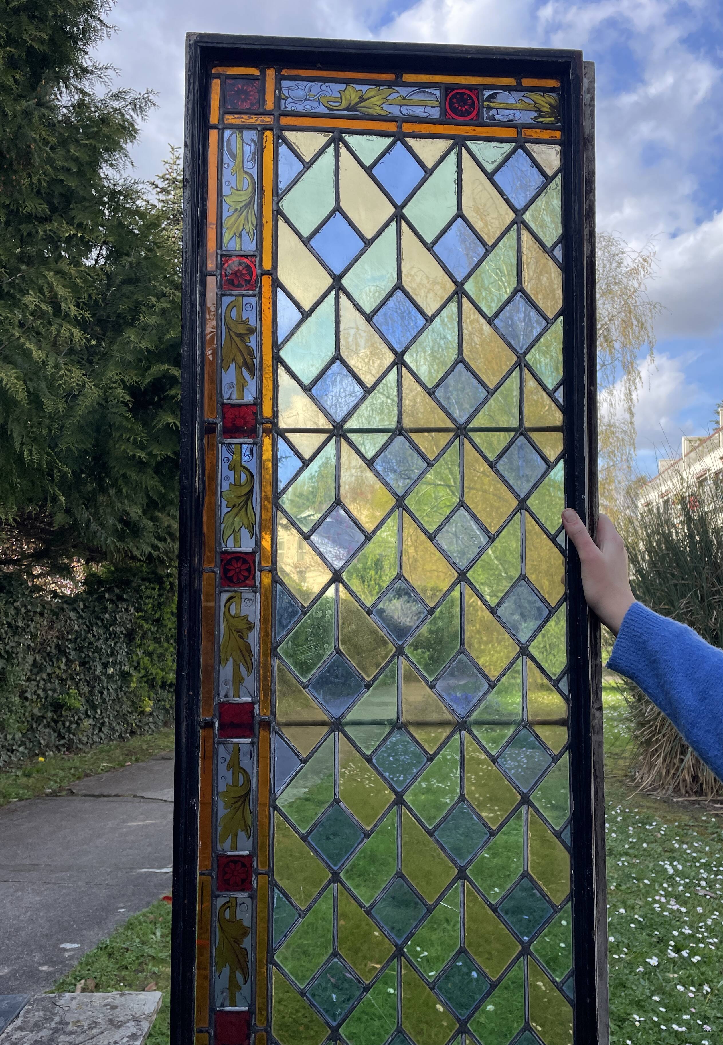 Pair of old double stained glass doors. Metal frames. Stained glass windows