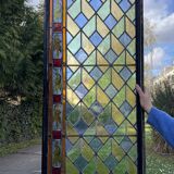 Pair of old double stained glass doors. Metal frames. Stained glass windows