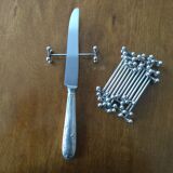 Set of twelve silver metal knife holders signed SFAM