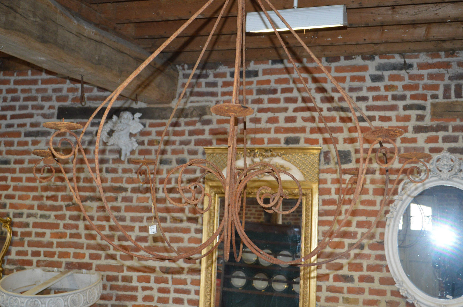 A wrought iron candle chandelier / 118 cms in diameter