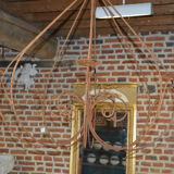 A wrought iron candle chandelier / 118 cms in diameter
