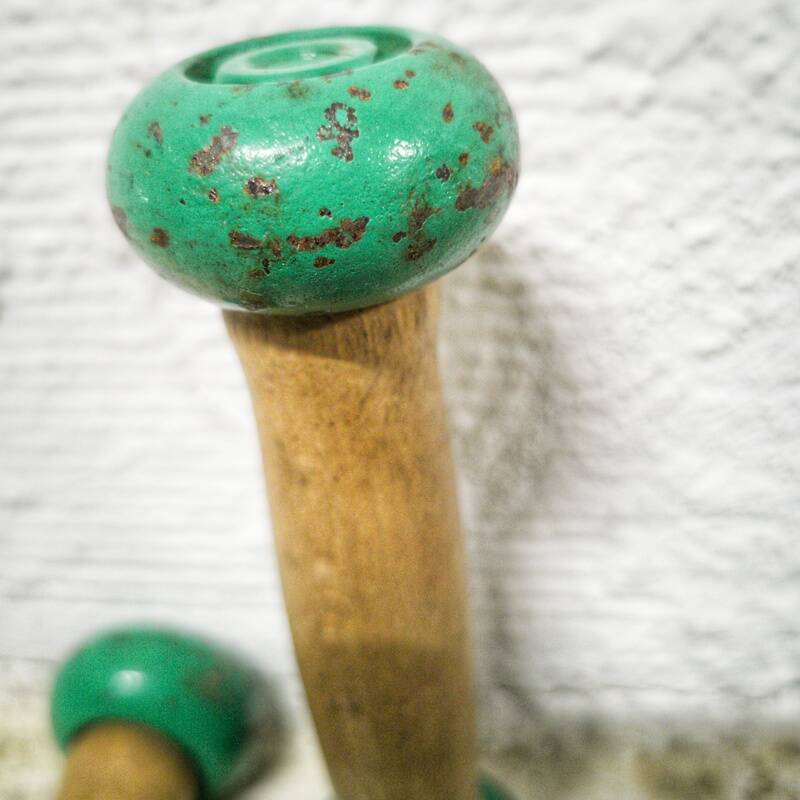 Pair of vintage cast iron and wood dumbbells