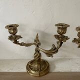 Pair of rocaille candlesticks in gilded bronze