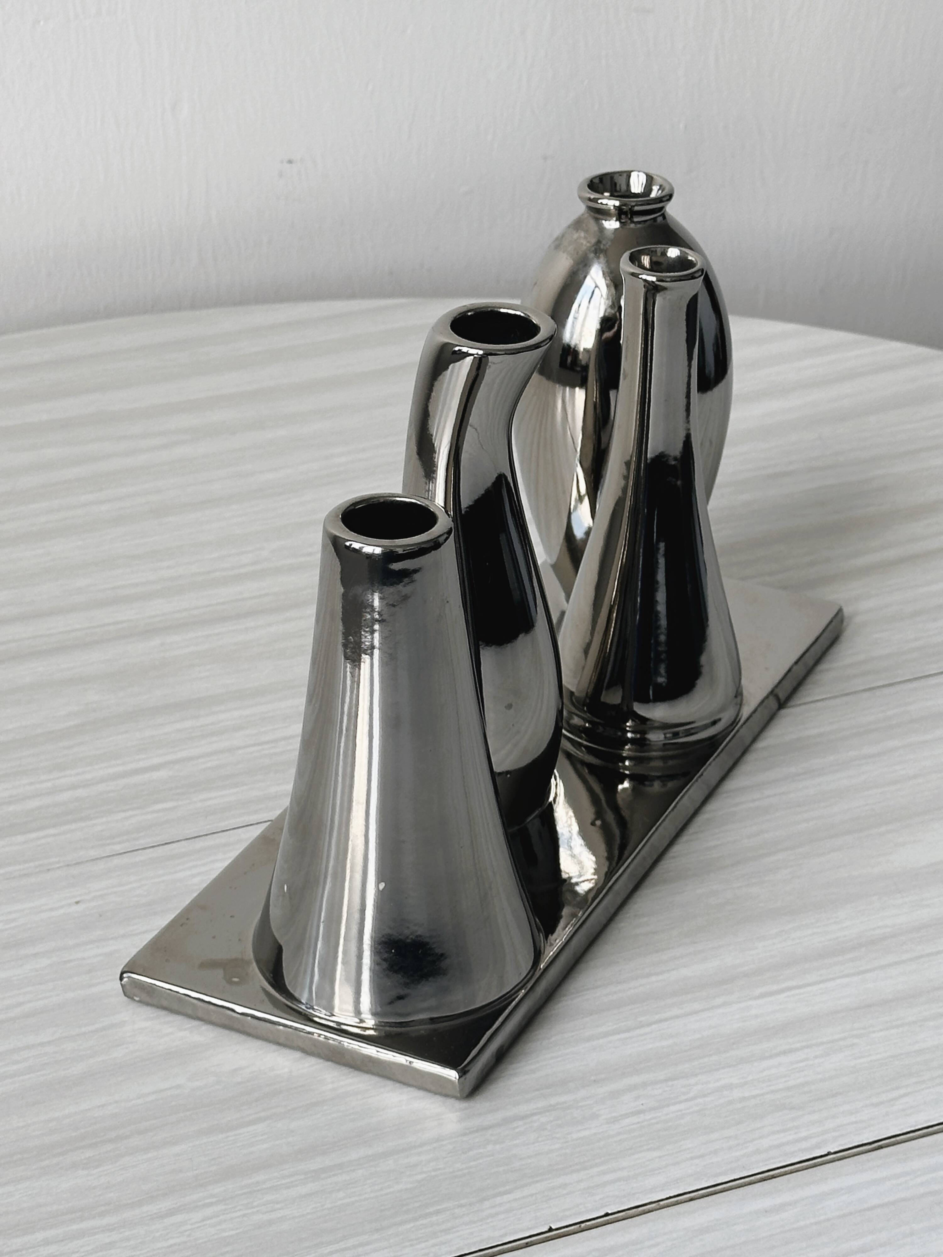 Silver soliflore vases.