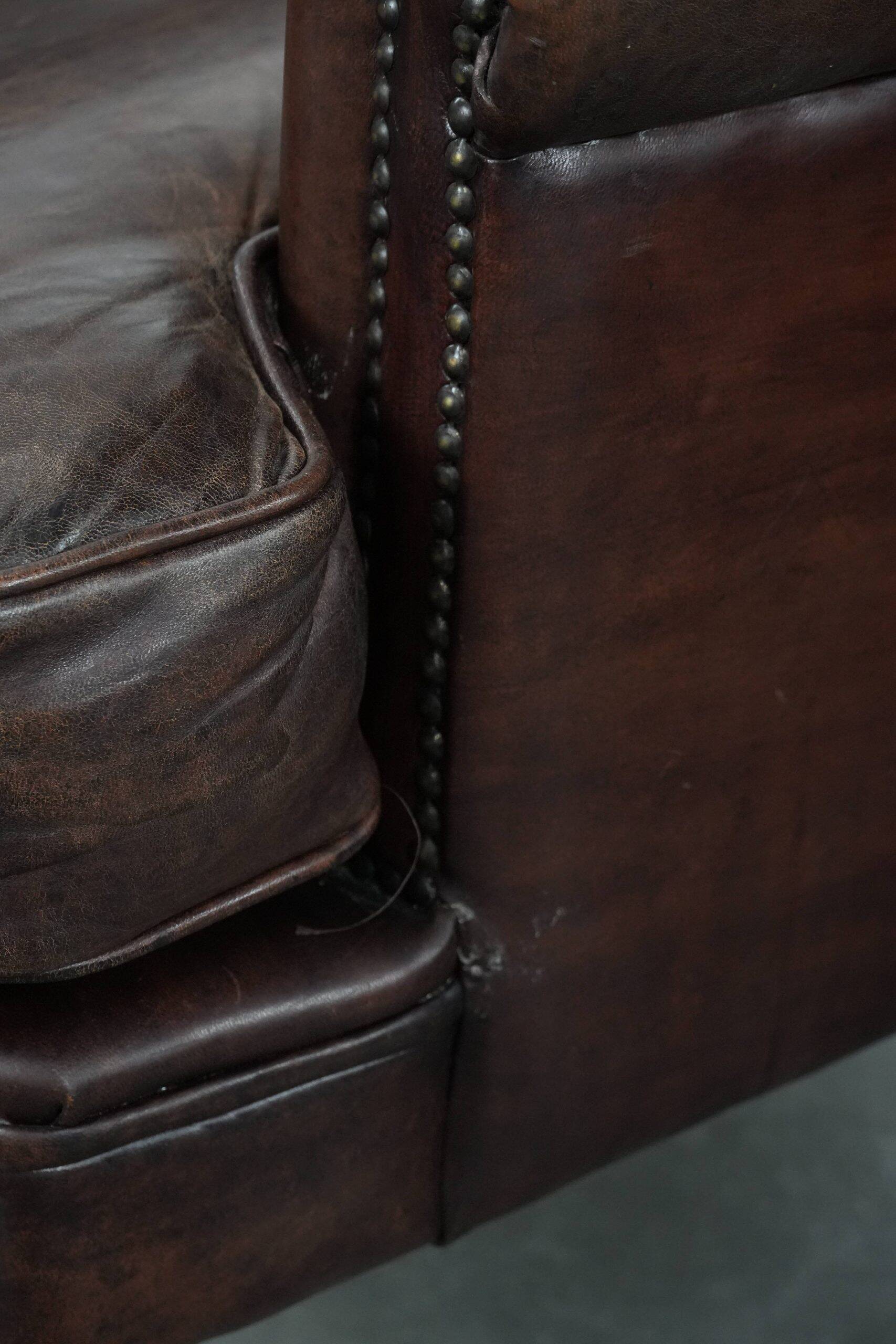 Set of two characterful sheepskin armchairs with a beautiful deep colour
