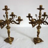 Pair of cherub candle holders in gilded bronze, early 20th century.