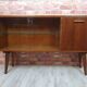 Renovated oak display cabinet with a bar on slanted legs