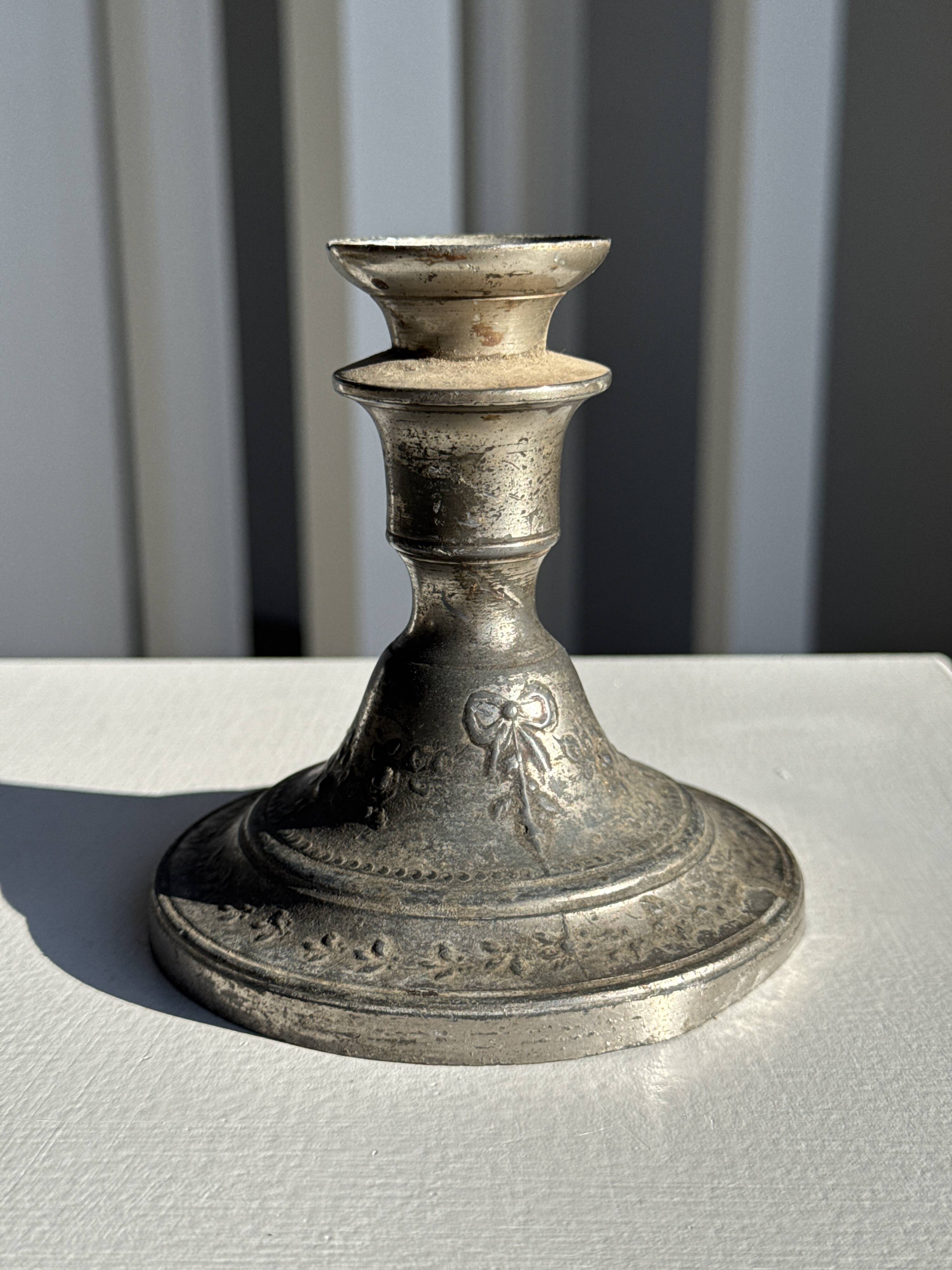 Small antique candle holder engraved in silver-plated metal, in its original condition.