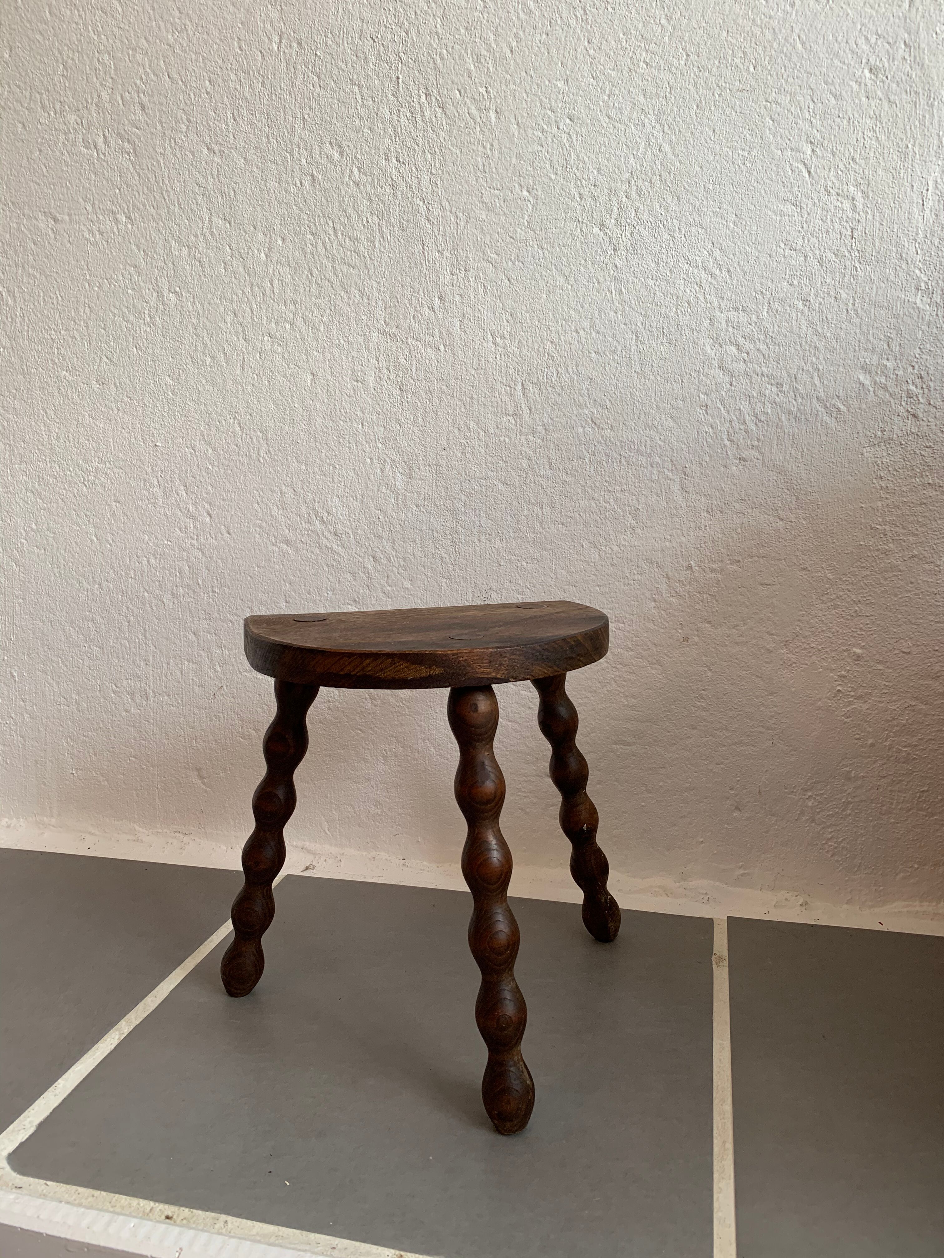 Old wood tripod farm stool