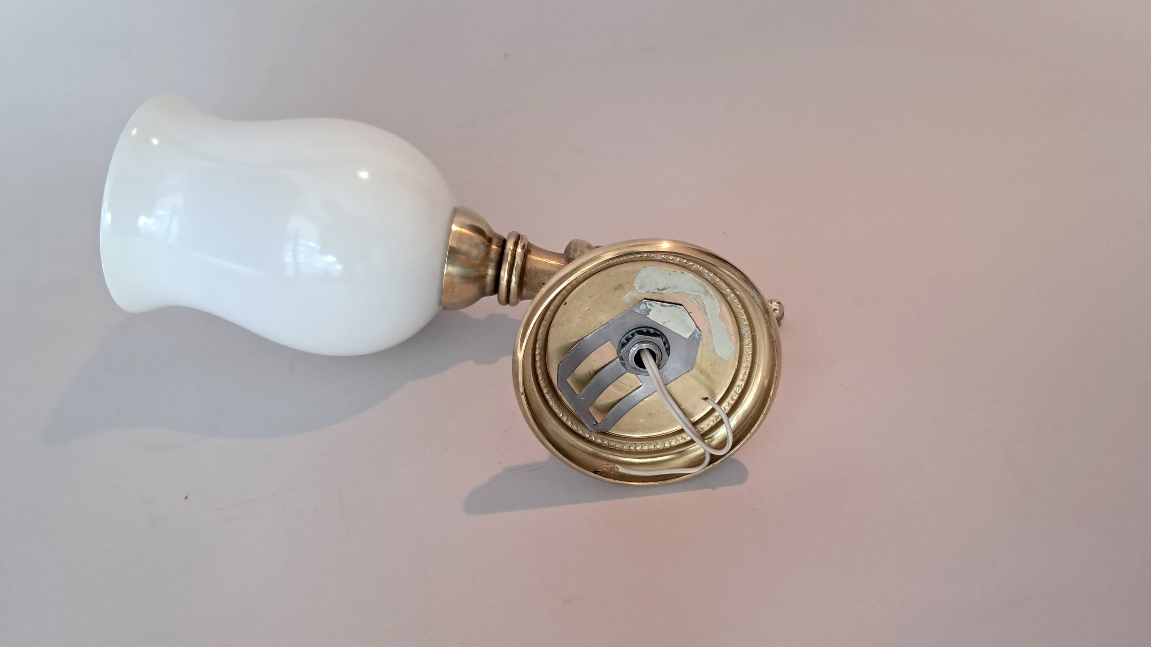 Golden brass wall light from the 1950s.