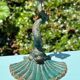 Antique candlestick base – stylised marine fish in patinated bronze