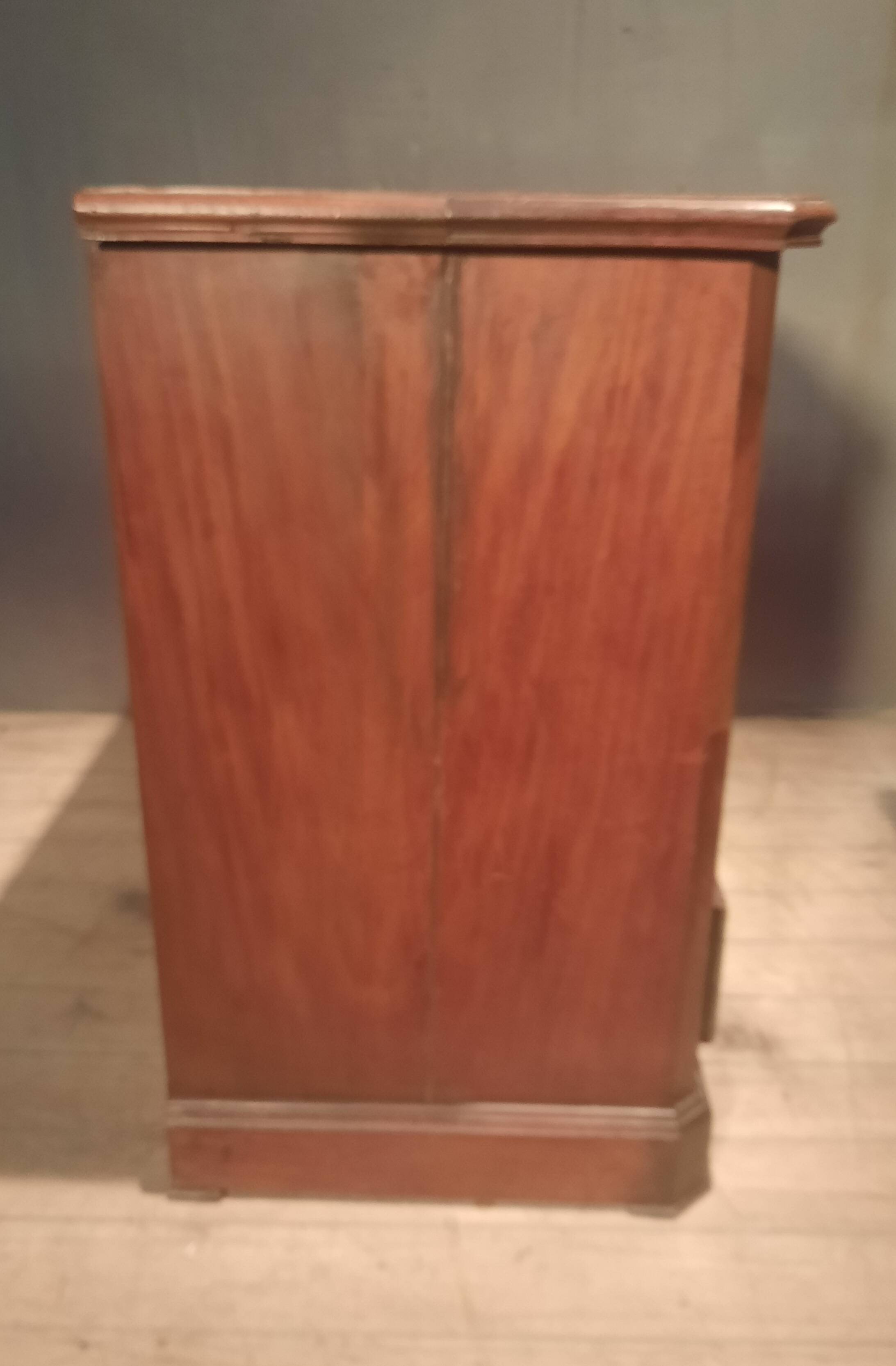 Small Louis Philippe chest of drawers with cut corners.