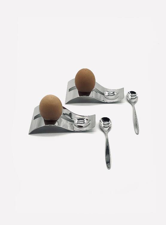 Two egg cups and two stainless steel spoons