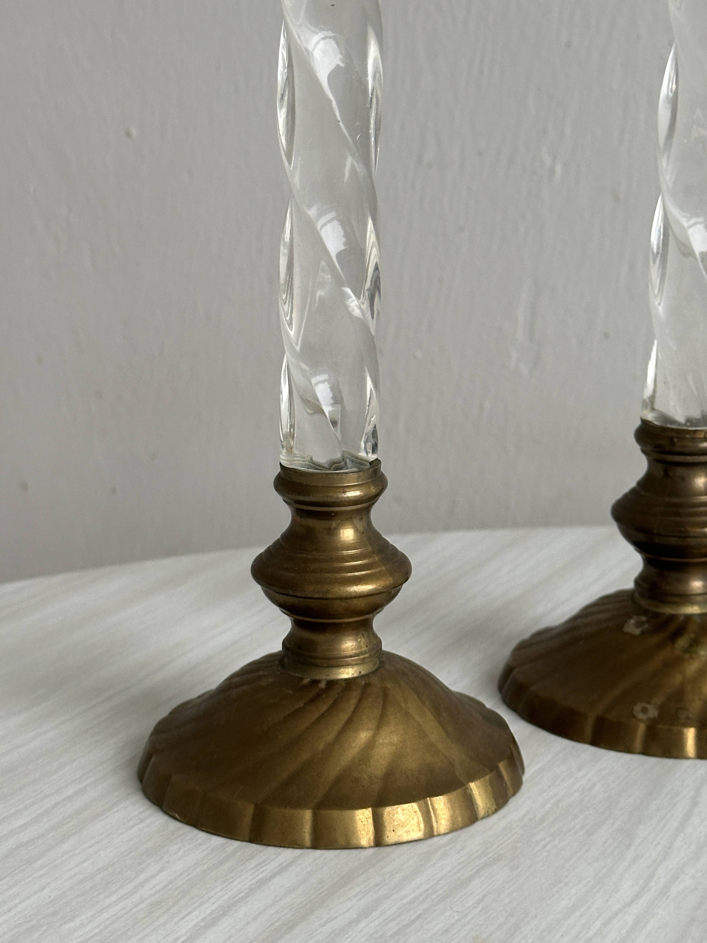 Pair of twisted metal and glass candlesticks