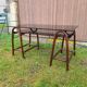 Smoked glass desk on rattan legs and leather detail