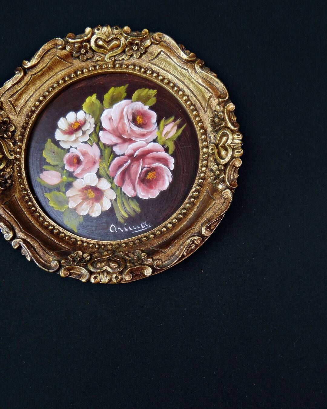 Still life in Tondo oil on panel of a bouquet of pink roses signed