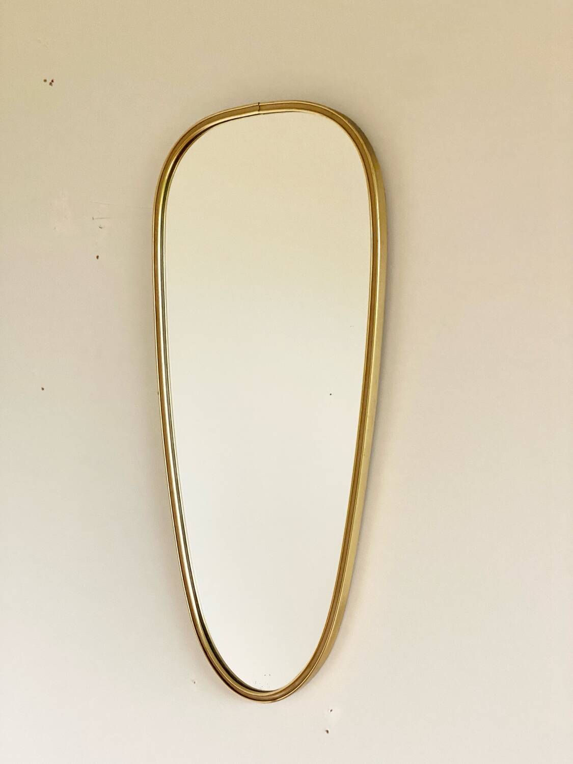 Vintage brass mirror in rear-view mirror shape