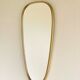 Vintage brass mirror in rear-view mirror shape