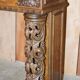 Antique fireplace from around 1880 in solid hand-carved elm with openwork columns.