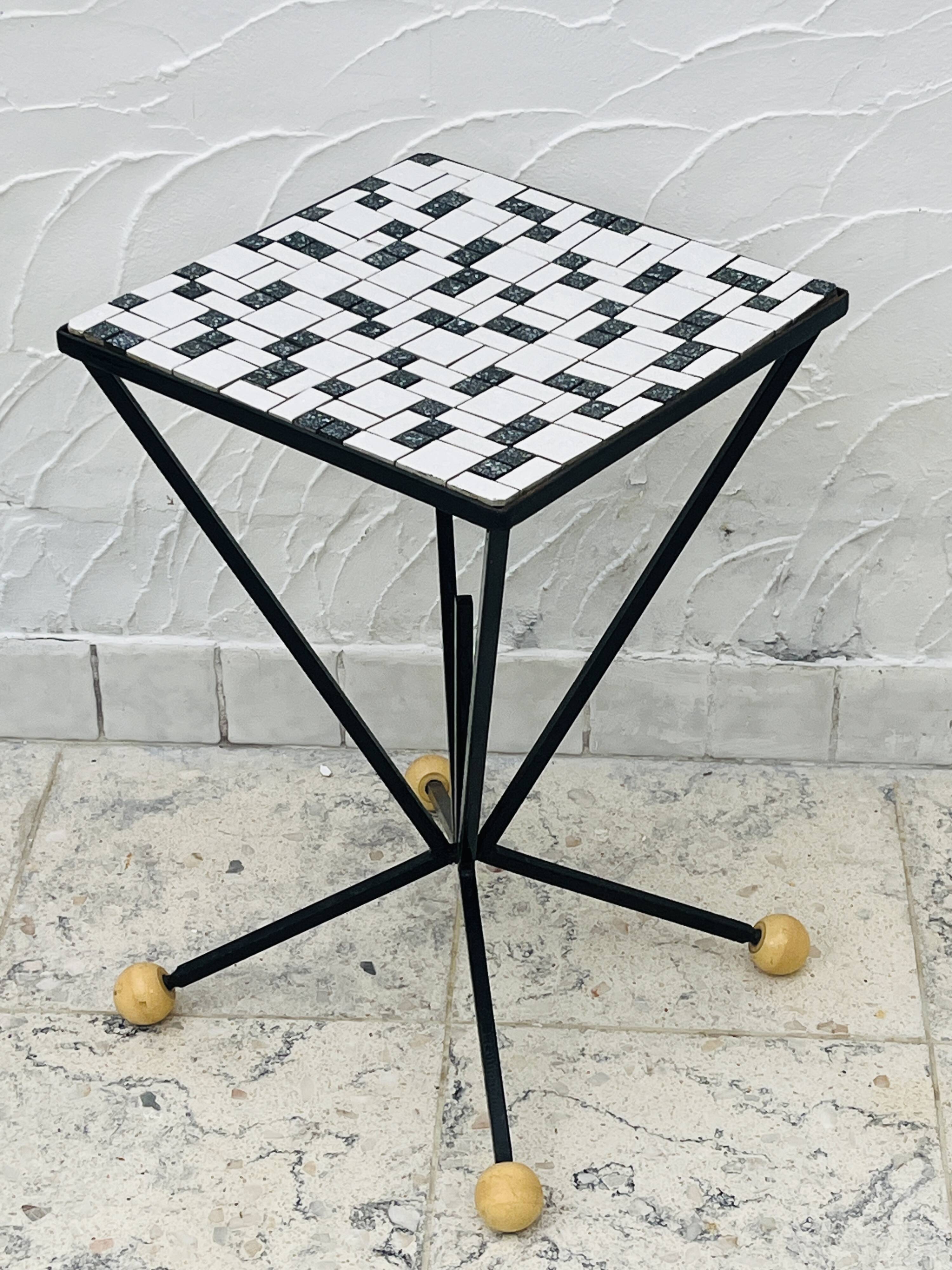 Wrought iron stela and black and white tiled top from the 1960s.