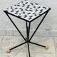 Wrought iron stela and black and white tiled top from the 1960s.
